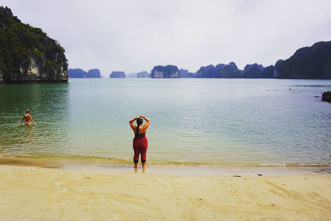 Tourist swimming in Ban Chan Beach, Halong Bay