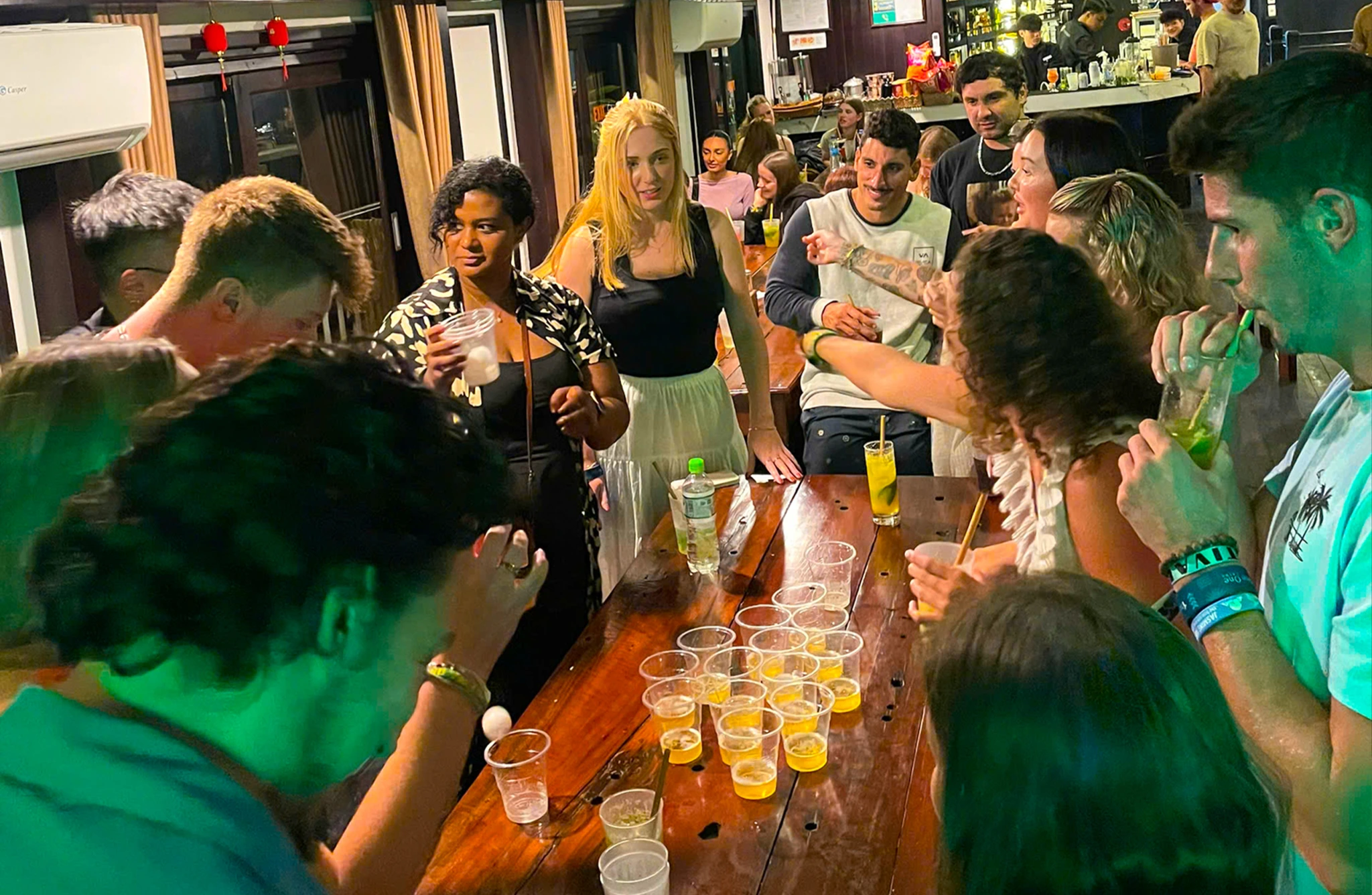 backpackers drinking in a halong bay cruise