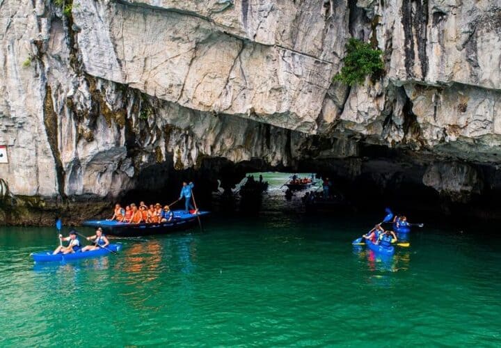 travelers getting inside Luon cave passage