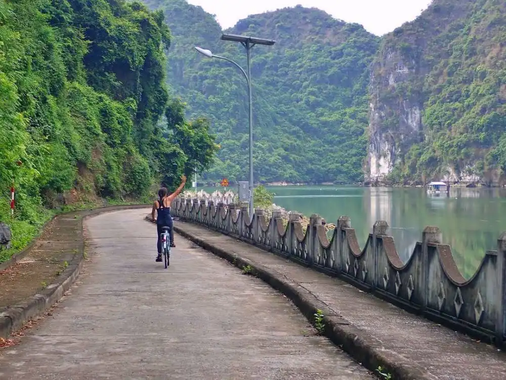 Tourist biking in Viet Hai Village