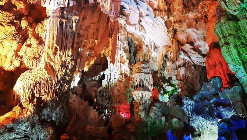 Stalagmites and stalactites with lighting inside Thien Cung Cave