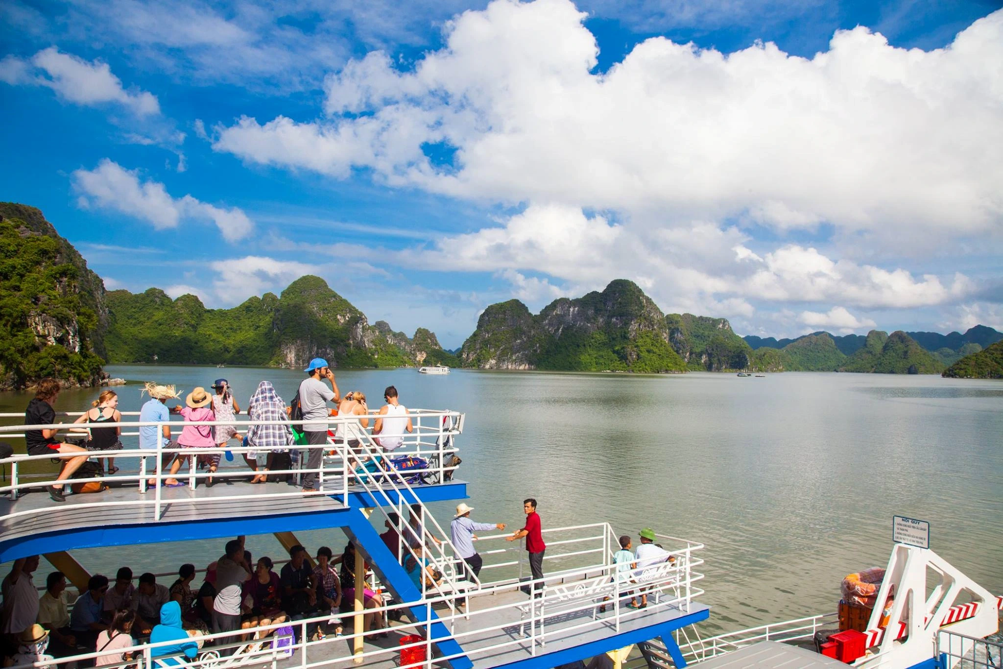 Travelers on a ferry to Gia Luan Port