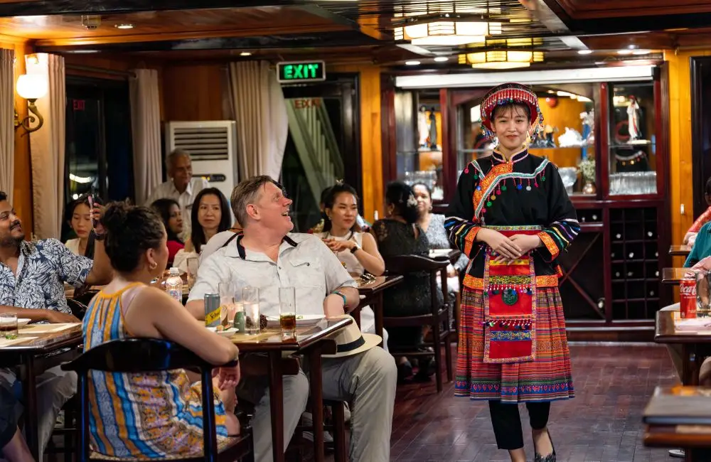 Crew performing welcome show in traditional costume