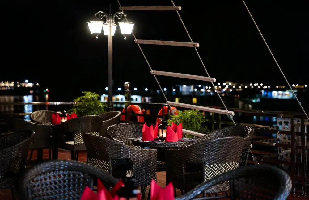 Table being set up on top deck for dinner