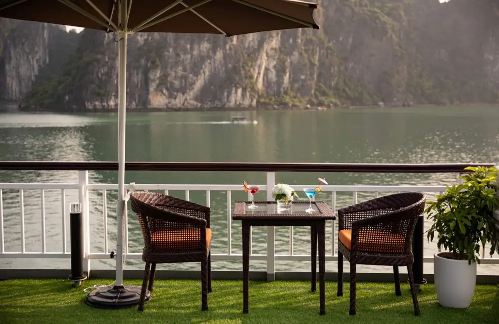Chairs and tables in sundeck view to the bay