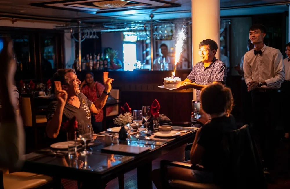 Passenger celebrating birthday with the crew
