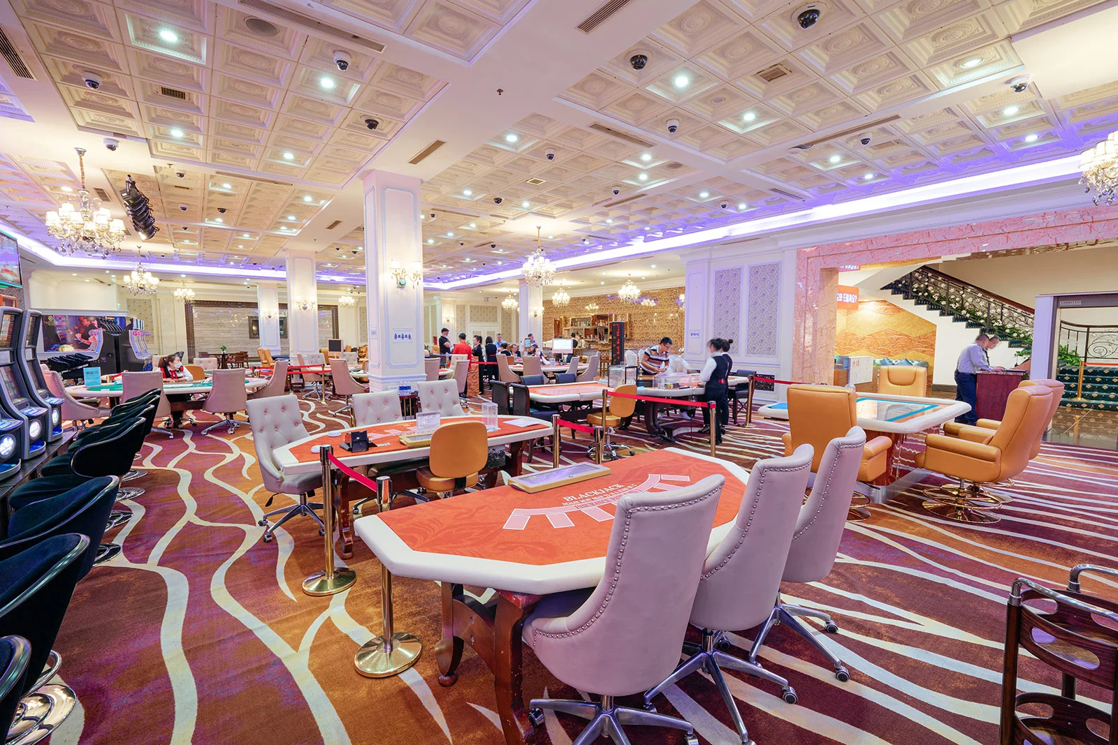 Slot machine and poker table in Royal Halong Hotel Casino