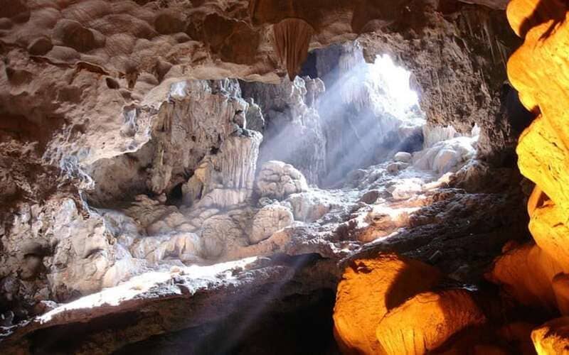 Natural light shining from cave ceiling